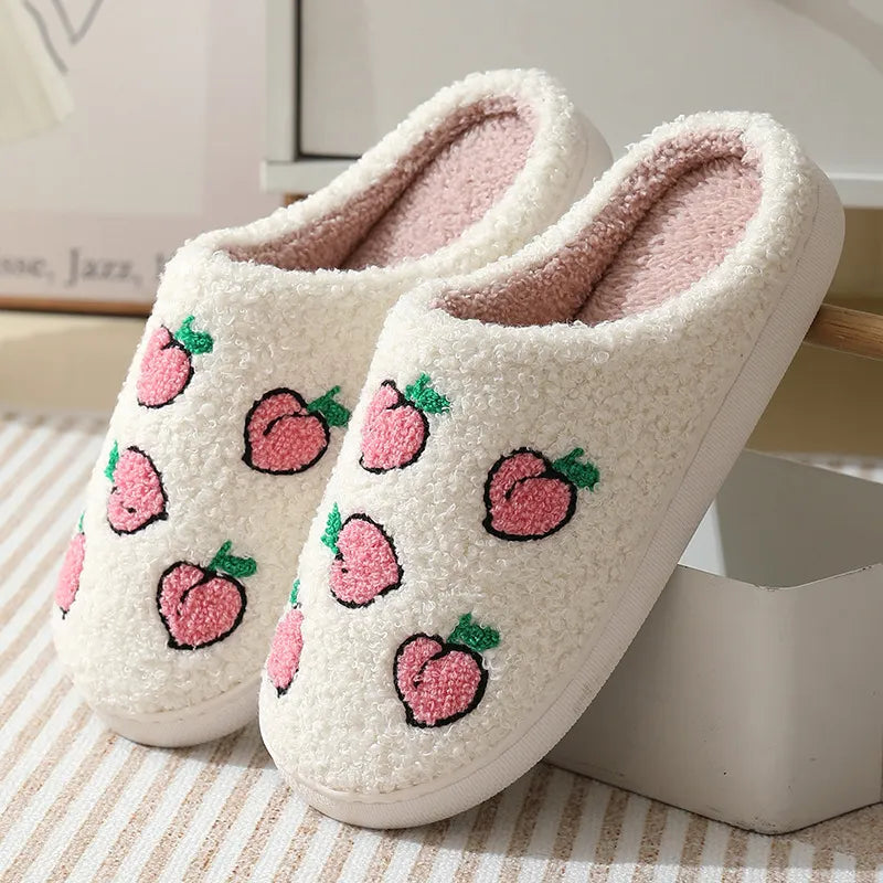 White/pink slipper with a peach pattern.