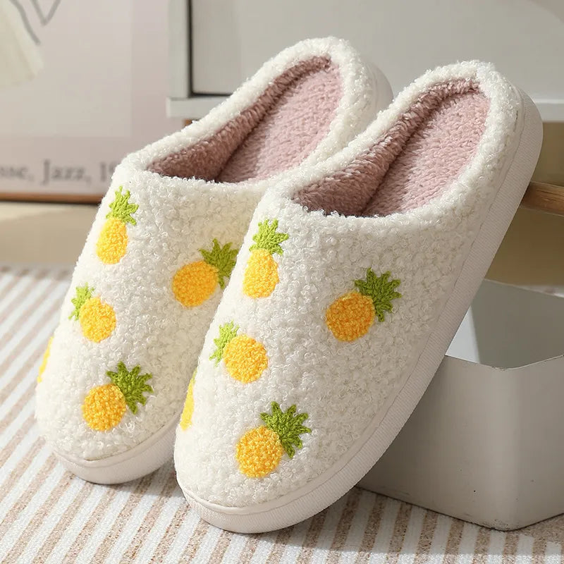 White/pink slipper with a pineapple pattern.