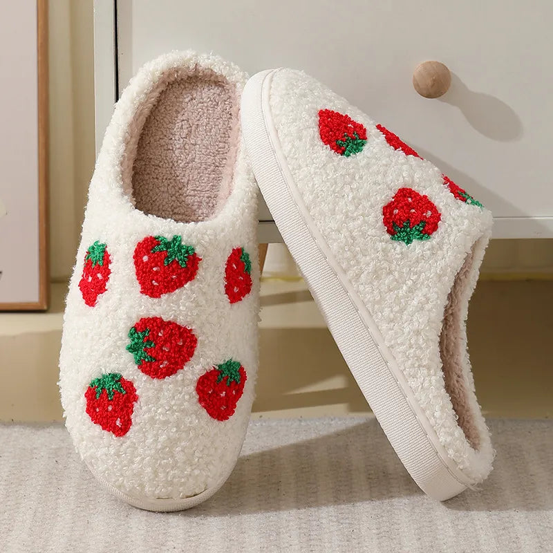 White/pink slipper with a strawberry pattern.